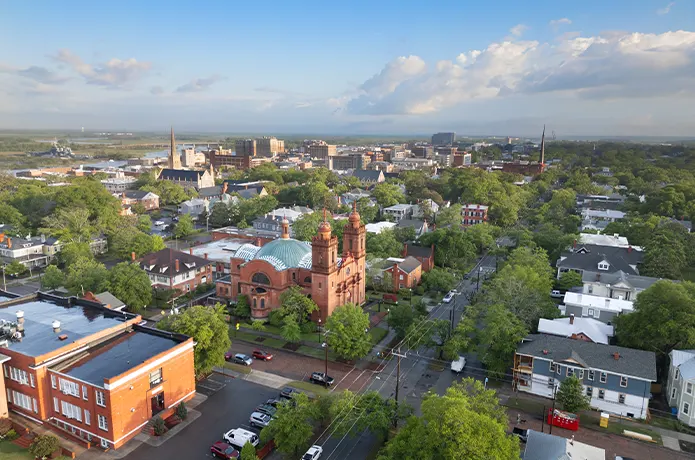 City View With Red-brick Church and Green Trees